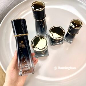 OEM ODM Custom Luxury 100ml 120ml Cosmetic Oil Skin Care Cream Personal Care With White Gold Black Round Glass Bottle